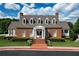 Charming brick clubhouse with manicured landscaping and a welcoming entrance for residents and guests at 4703 Legacy Cove Ln, Smyrna, GA 30126