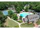 Resort-style community pool, complete with a waterslide, tennis court, ample seating, and lush landscaping at 4703 Legacy Cove Ln, Smyrna, GA 30126