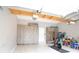 Organized garage with storage cabinets, a bike, and an epoxy floor at 4703 Legacy Cove Ln, Smyrna, GA 30126
