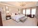 This main bedroom is spacious with a tray ceiling, carpet, and many windows at 4703 Legacy Cove Ln, Smyrna, GA 30126