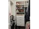 Organized walk-in closet with hanging clothes, shoe racks and drawers at 4703 Legacy Cove Ln, Smyrna, GA 30126