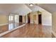 Large bedroom with hardwood floors, mirrored wall, and ensuite bathroom at 5547 Nelson Pointe Dr, Stone Mountain, GA 30087