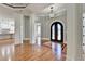 Elegant two-story entryway with hardwood floors and arched doorway at 5547 Nelson Pointe Dr, Stone Mountain, GA 30087