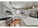 Gourmet kitchen with stainless steel appliances and marble countertops at 5547 Nelson Pointe Dr, Stone Mountain, GA 30087