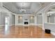 Elegant living room with hardwood floors and a central fireplace at 5547 Nelson Pointe Dr, Stone Mountain, GA 30087