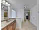 Bathroom with granite countertop, large mirror and tile flooring at 3473 Blanding Ct, Buford, GA 30519