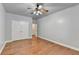 Large bedroom with hardwood floors and double doors to closet at 3473 Blanding Ct, Buford, GA 30519