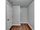 Small bedroom with hardwood floors and white door at 3473 Blanding Ct, Buford, GA 30519