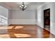 Bright dining room with hardwood floors and elegant chandelier at 3473 Blanding Ct, Buford, GA 30519