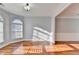 Sunlit dining room with hardwood floors and arched window at 3473 Blanding Ct, Buford, GA 30519