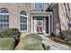 Brick facade with a double-door entry and landscaping at 3473 Blanding Ct, Buford, GA 30519