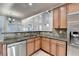 Kitchen boasts granite countertops, stainless steel appliances, and breakfast bar at 3473 Blanding Ct, Buford, GA 30519