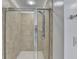 Shower with glass enclosure and tile surround at 3473 Blanding Ct, Buford, GA 30519