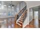 Elegant staircase with wrought iron railing and hardwood treads at 3473 Blanding Ct, Buford, GA 30519