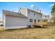 View of the home's back exterior, deck, siding, lawn, and an air conditioning unit at 4390 Allgood Pl, Stone Mountain, GA 30083