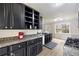 Bright kitchen featuring granite countertops, hardwood floors and modern stainless steel gas range at 4390 Allgood Pl, Stone Mountain, GA 30083