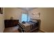 Bedroom with dresser and a bed with striped bedding at 6268 Odum Cir, Covington, GA 30014