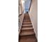 Staircase with carpeted steps and metal railing at 6268 Odum Cir, Covington, GA 30014