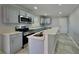 Modern kitchen featuring stainless steel appliances and an island at 2422 Tiffany Cir, Decatur, GA 30035