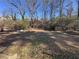 Large backyard with basketball goal and shed at 7480 Ambassador Dr, Riverdale, GA 30296