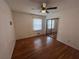 Spacious bedroom with hardwood floors and mirrored closet doors at 7480 Ambassador Dr, Riverdale, GA 30296