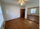 Hardwood floor bedroom with mirrored closet doors at 7480 Ambassador Dr, Riverdale, GA 30296