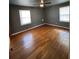 Spacious bedroom with hardwood floors and ceiling fan at 7480 Ambassador Dr, Riverdale, GA 30296
