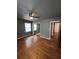 Bedroom with hardwood floors and mirrored closet doors at 7480 Ambassador Dr, Riverdale, GA 30296