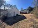 White detached garage and yard at 7480 Ambassador Dr, Riverdale, GA 30296