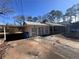 Brick ranch house with carport and large yard at 7480 Ambassador Dr, Riverdale, GA 30296