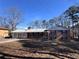 Brick ranch house with a spacious yard at 7480 Ambassador Dr, Riverdale, GA 30296