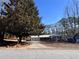 Brick ranch house with mature trees and a long driveway at 7480 Ambassador Dr, Riverdale, GA 30296