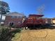 Brick house back with deck and yard at 7480 Ambassador Dr, Riverdale, GA 30296