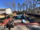 Inground pool with pool cover and surrounding yard at 7480 Ambassador Dr, Riverdale, GA 30296