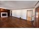 Spacious living room with hardwood floors and fireplace at 7480 Ambassador Dr, Riverdale, GA 30296