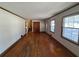 Bright living room with hardwood floors and lots of windows at 7480 Ambassador Dr, Riverdale, GA 30296