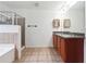Double vanity bathroom with a large soaking tub and shower at 2005 Creek Pointe Way, Villa Rica, GA 30180