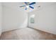 Bright bedroom with ceiling fan and neutral carpeting at 2005 Creek Pointe Way, Villa Rica, GA 30180