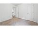 Bedroom with double door closets and access to hallway at 2005 Creek Pointe Way, Villa Rica, GA 30180