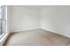 Bright bedroom with neutral carpet and large window at 2005 Creek Pointe Way, Villa Rica, GA 30180