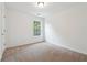 Bright bedroom with large window and neutral carpet at 2005 Creek Pointe Way, Villa Rica, GA 30180