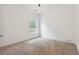Bright bedroom with neutral walls and carpet at 2005 Creek Pointe Way, Villa Rica, GA 30180