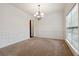Formal dining room with chandelier and wainscoting at 2005 Creek Pointe Way, Villa Rica, GA 30180