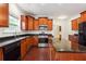 Modern kitchen featuring granite countertops and ample wood cabinetry at 2005 Creek Pointe Way, Villa Rica, GA 30180