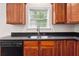 Kitchen boasts granite countertops and a double-basin sink at 2005 Creek Pointe Way, Villa Rica, GA 30180