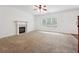 Living room with fireplace and ceiling fan at 2005 Creek Pointe Way, Villa Rica, GA 30180