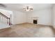 Living room with fireplace and staircase at 2005 Creek Pointe Way, Villa Rica, GA 30180