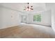 Bright main bedroom featuring a large window and ceiling fan at 2005 Creek Pointe Way, Villa Rica, GA 30180