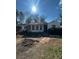 Ranch style home with a sunlit front yard at 2104 Cascade Sw Rd, Atlanta, GA 30311