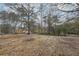 Large backyard with mature trees at 2426 Windridge Dr, Conyers, GA 30013